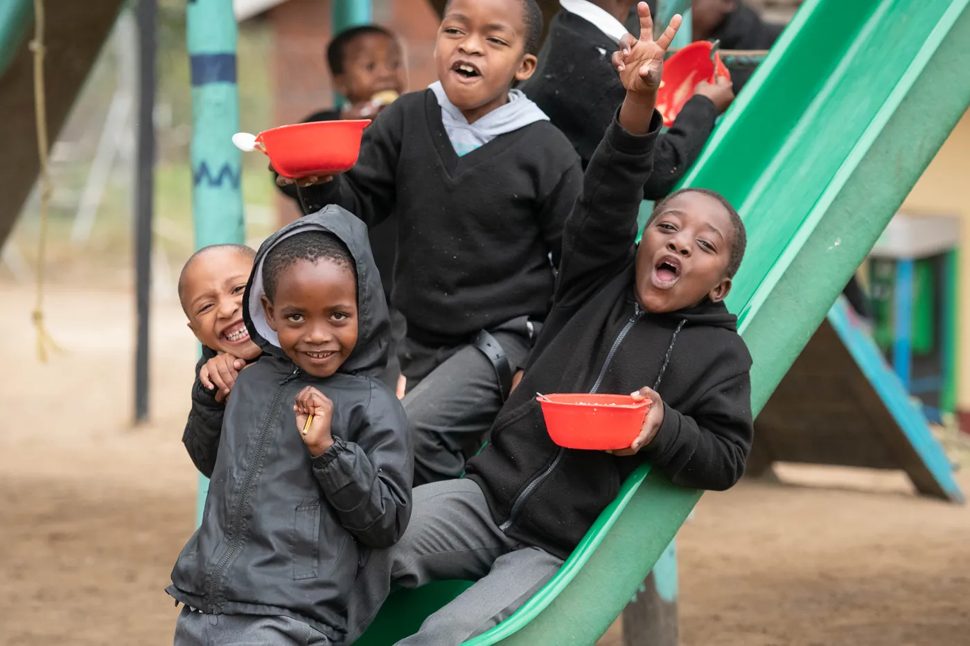 Children laughing on the slide at a Thanda centre