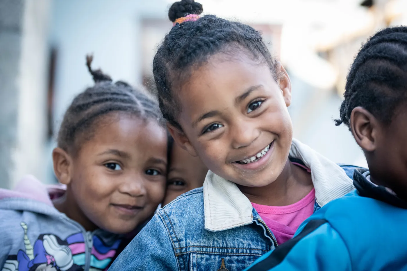 Two girls smiling cheek to cheek at a True North centre
