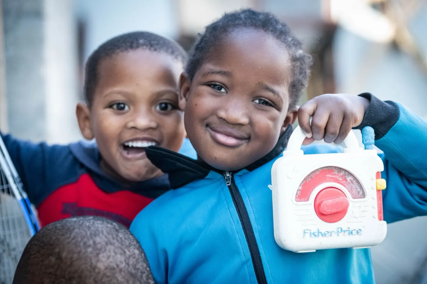 Two boys smiling together at a True North early learning centre